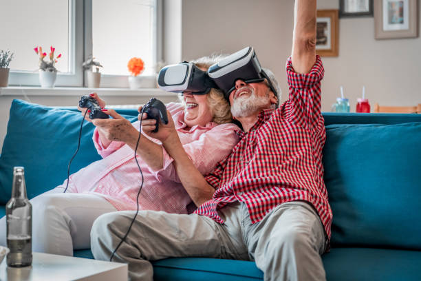 istock Mature couple playing virtual reality games. Virtual Reality Simulator. 1171808045