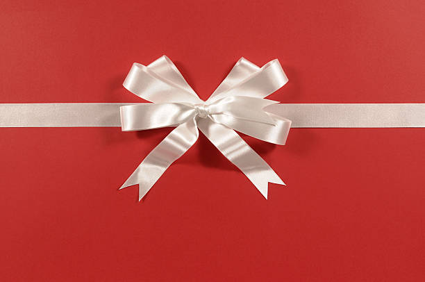 istock White gift ribbon and bow on red paper 117180830