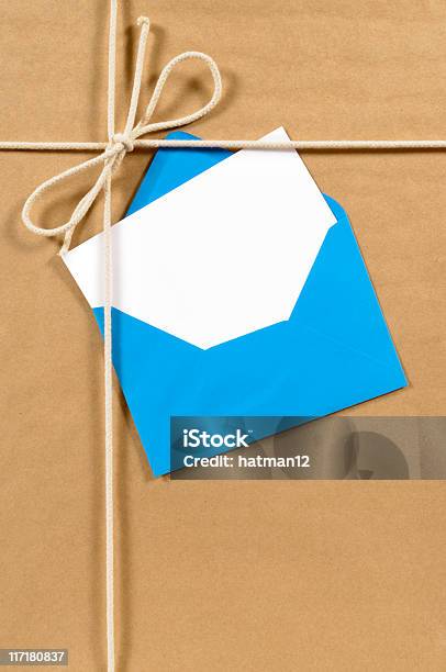 Brown Paper Parcel With Blue Envelope Stock Photo - Download Image Now - Angle, Anniversary, Anniversary Card