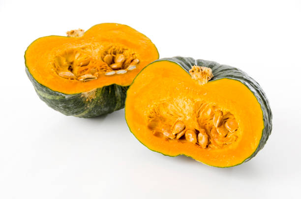 Half of the green pumpkin on white background Half of the green pumpkin on white background kabocha stock pictures, royalty-free photos & images