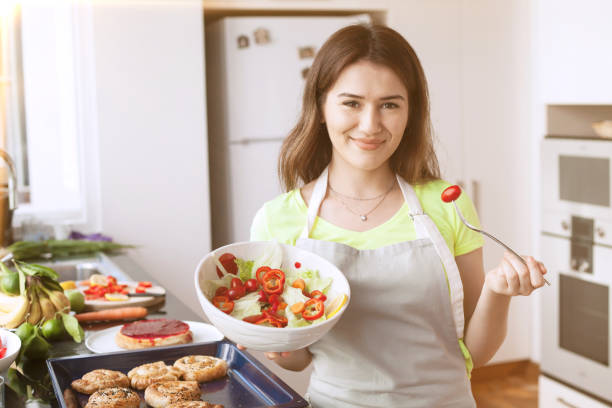 istock young woman at domestic kitchen 1171812331