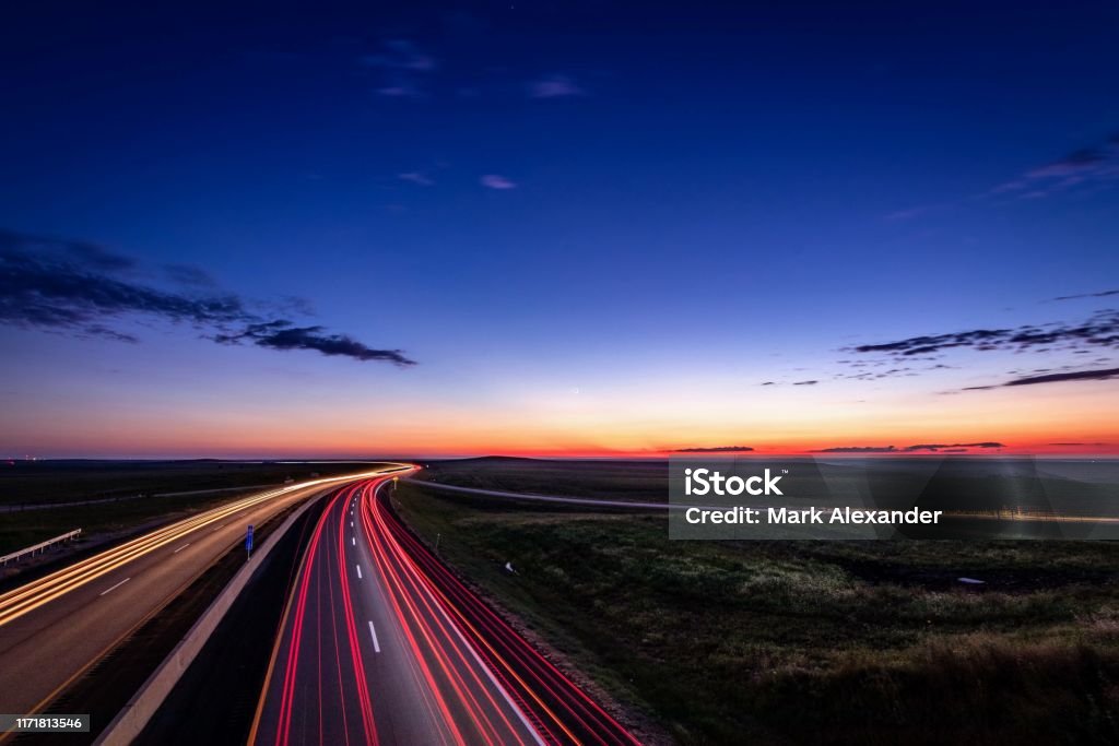 Flint Hills traffic Turnpike at dusk in the flint hills of Kansas Road Stock Photo