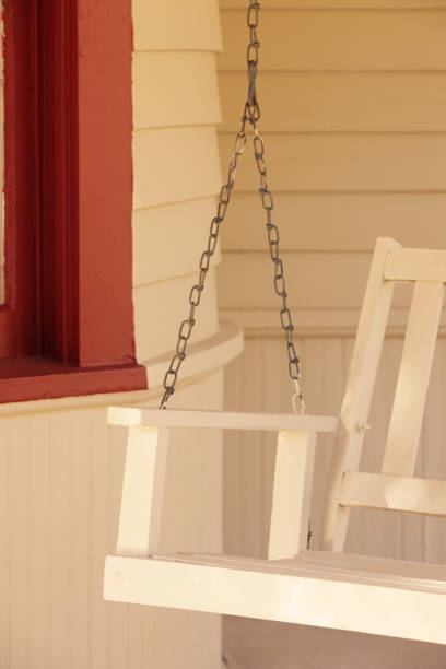 istock Nostalgic Porch Swing Vintage American Scene 1171817214