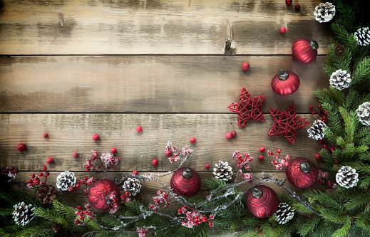 Christmas holiday garland on an old rustic wood background