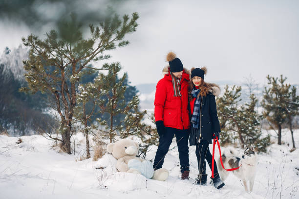 istock Beautiful couple playing with a dog 1171818458