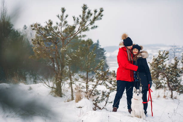 istock Beautiful couple playing with a dog 1171818990