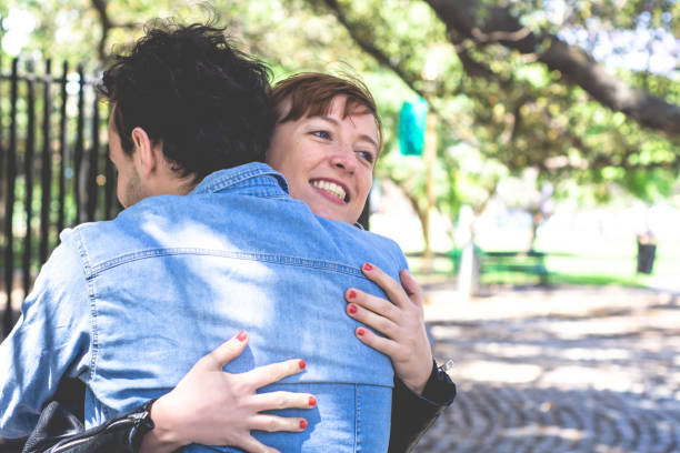istock Happy couple hugging outdoors 1171820465