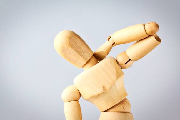 Wooden Mannequin Figure Expressing Neck Pain stock photo