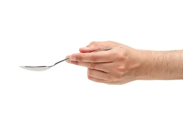 man hand using a spoon against a white background