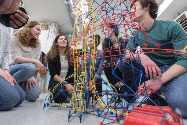 istock Ethnic art teacher shows her class a colorful example of sculpture 1171825922