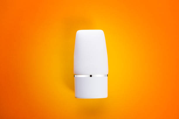 istock Blank white squeeze bottle plastic tube with flip top view on orange background 1171833249