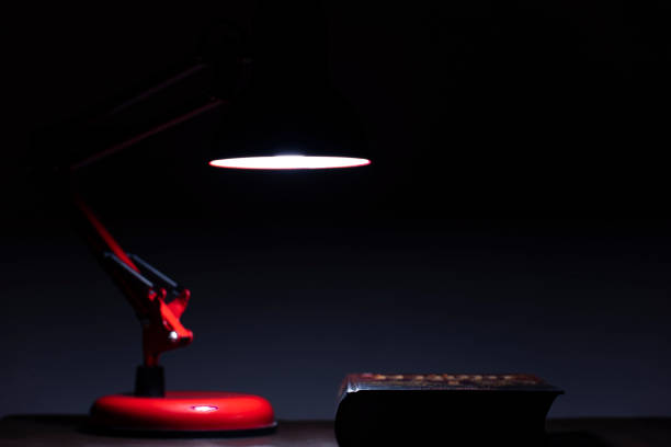 istock The lamp and the book on the table. 1171835182