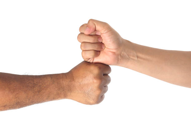 istock Two men bumping fists isolated on white 1171839517