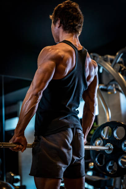 istock Back view of a man training in a personal training gym 1171840267