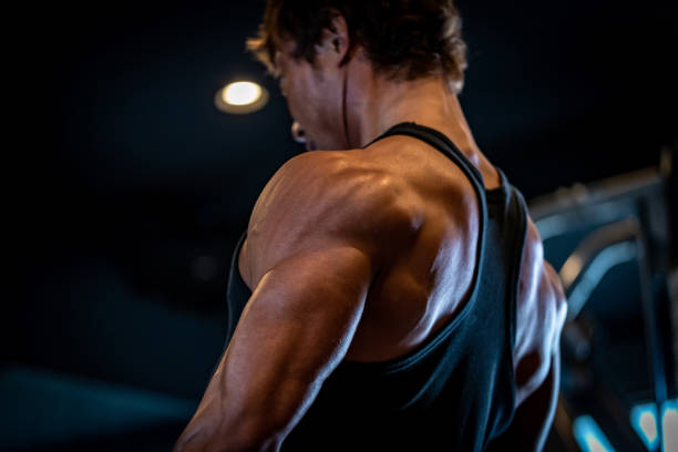 Mature man doing training in personal training gym