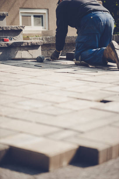 istock Senior man installing paving stones 1171840963