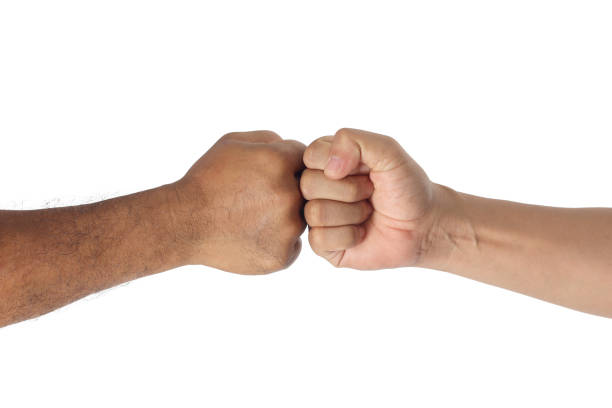istock Two men bumping fists isolated on white 1171841066