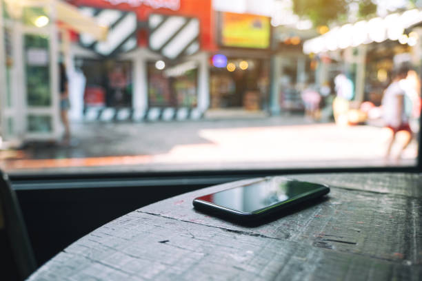istock a mobile phone on wooden table 1171841127