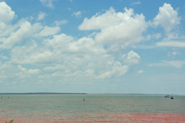 istock Lake and clouds in blue sky 1171842533