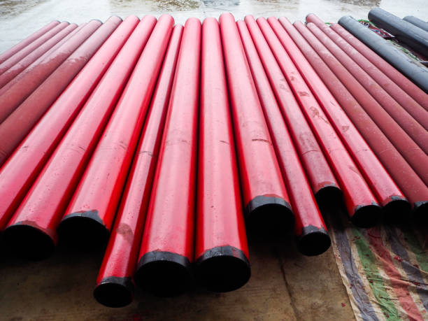 istock Black steel pipe painted in red 1171846811
