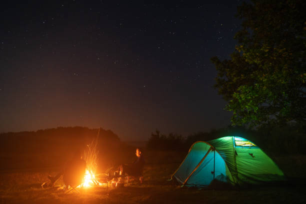 istock Two tourists resting by the fire 1171849855
