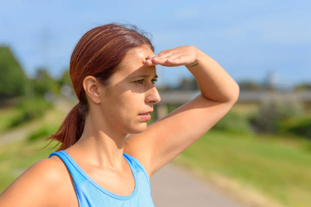 istock Attractive tanned woman standing watching 1171854218