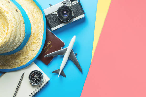 istock Travel accessories objects and gadgets top view flatlay on blue yellow pink 1171855208