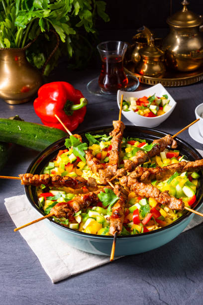 istock Lamb skewers with curry rice and different vegetables 1171859582