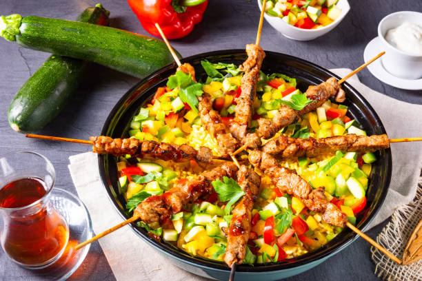 istock Lamb skewers with curry rice and different vegetables 1171859598