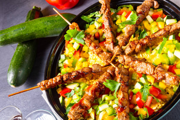 istock Lamb skewers with curry rice and different vegetables 1171859614
