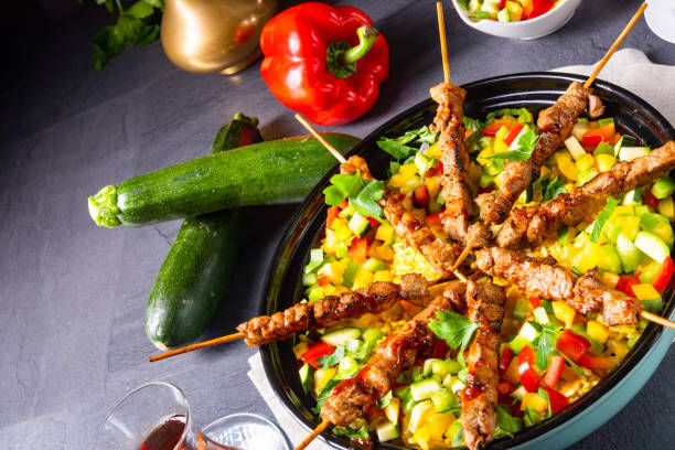 istock Lamb skewers with curry rice and different vegetables 1171859621
