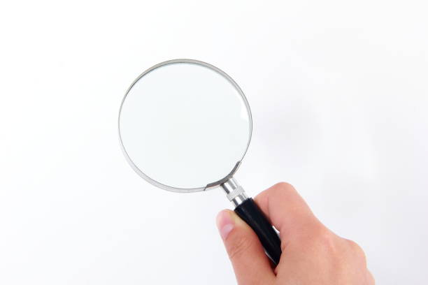 istock Woman hand holding a magnifier 1171860449