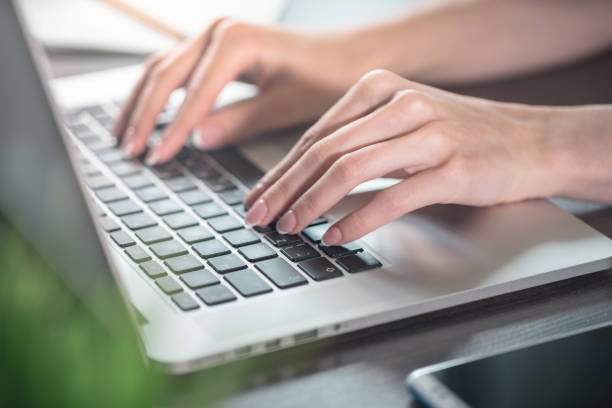 istock Woman typing on a laptop 1171865860