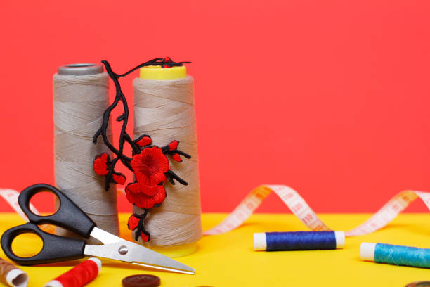 istock Two large spools of thread are standing, many small spools are lying. 1171865888