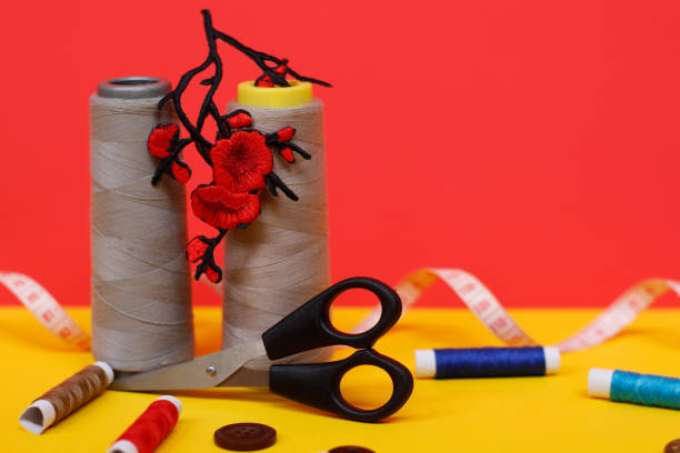istock Two large spools of thread are standing, many small spools are lying. 1171865912