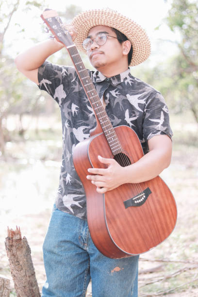 istock Young Brown Skin Guitarist From Thailand 1171866933