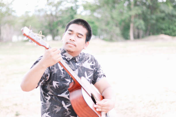 istock Young Brown Skin Guitarist From Thailand 1171866962