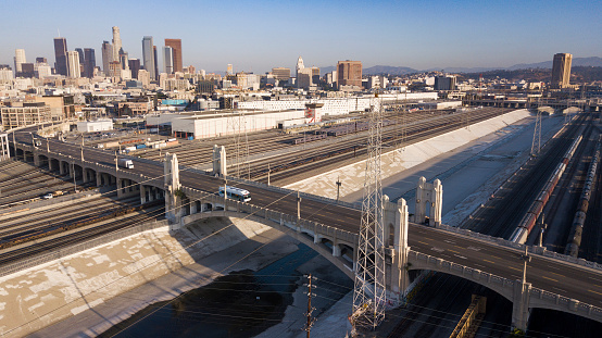 Aerial view of the Los Angeles River passing underneath the 4th Street Bridge through Downtown Los Angeles.