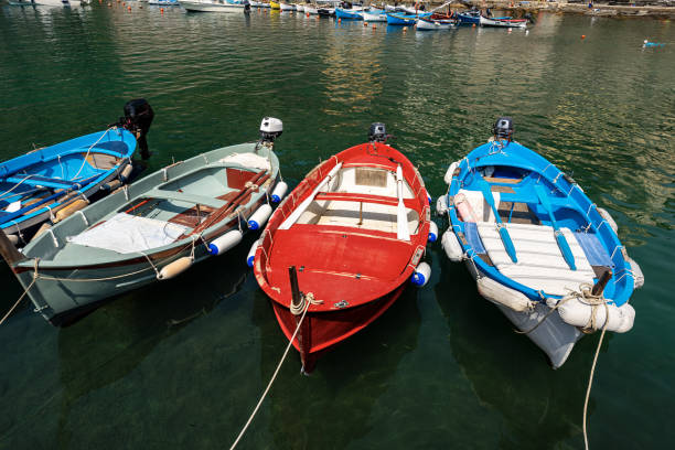 small boats in vernazza harbor - cinque terre liguria italy - rowboat nautical vessel small motorboat imagens e fotografias de stock