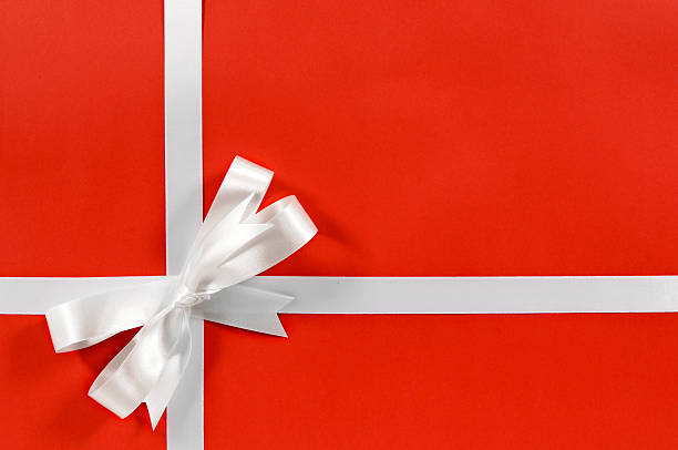 istock White gift ribbon on red paper 117186940