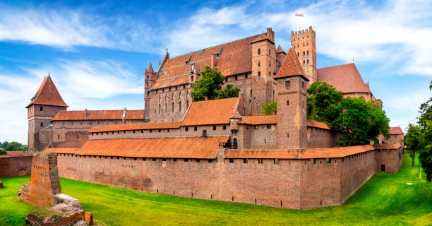 Medieval Malbork Castle, Poland Malbork, Poland - July 27, 2019:Medieval Malbork Castle, Poland. The largest castle in the world by surface area, and the largest brick building in Europe. Historical capitol of the Teutonic Order - Crusaders malbork photos stock pictures, royalty-free photos & images