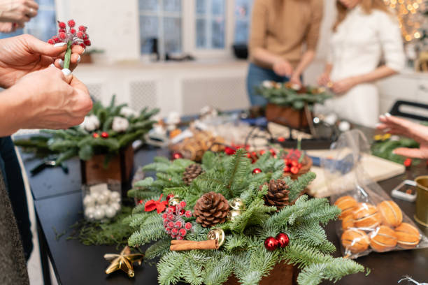 istock Master class on making decorative ornaments. Flower shop. Christmas decor with their own hands. Woman created a xmas arrangement. 1171871263