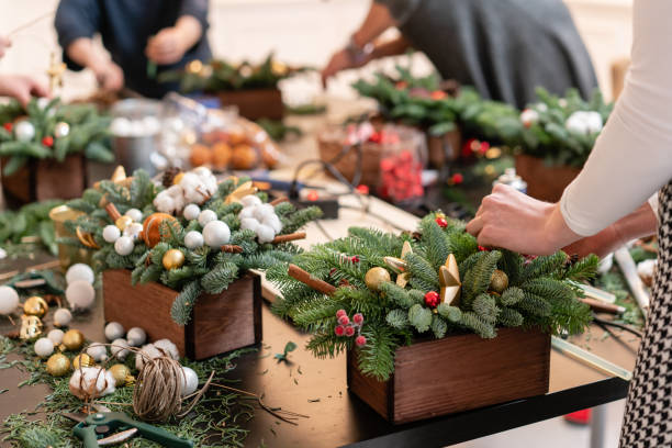 istock Master class on making decorative ornaments. Flower shop. Christmas decor with their own hands. Woman created a xmas arrangement. 1171871638