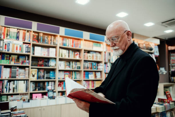 istock Senior man in bookstore 1171874511