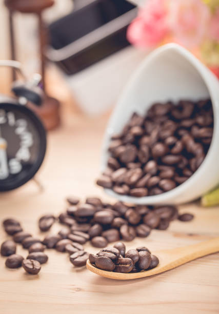 istock coffee beans and wood background 1171875440