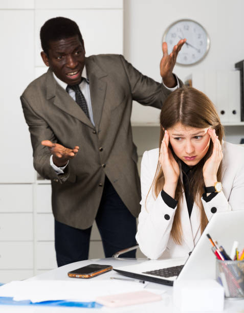 istock Upset woman with angry boss 1171875707