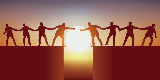 Concept of solidarity with men who try to overcome an obstacle by joining forces. Concept of teamwork with two groups of men, separated by a chasm that tries to join each other by holding each other to succeed in overcoming the obstacle. bridging the gap stock illustrations