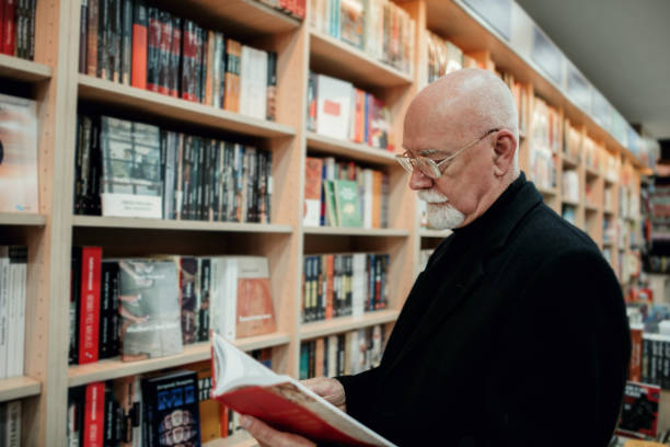 istock Senior man in bookstore 1171876110