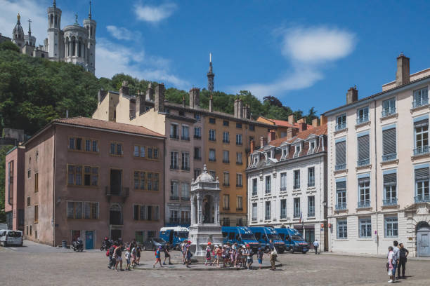 Saint-Jean Square in Old Lyon June 18, 2019 - Lyon, France: People walking across Saint-Jean Square in Old Lyon st jean saint barthelemy stock pictures, royalty-free photos & images