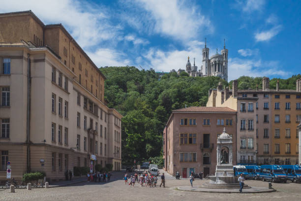 June 18, 2019 - Lyon, France: People walking across Saint-Jean Square in Old Lyon